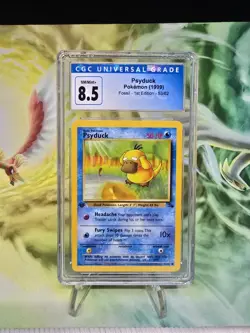 1999 Psyduck Fossil 1st Edition Pokemon TCG Card 53/62 HP - CGC 8.5 - NM/MINT+ - Image 1