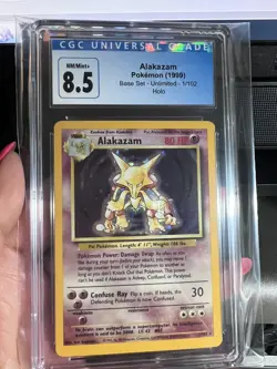 1999 WOTC Pokemon Base Set Alakazam 1/102 Unlimited Holo TCG CGC 8.5 NM/MINT+ - Image 1