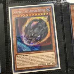 Yu-Gi-Oh Card - RA01-EN015 - NIBIRU, THE PRIMAL BEING (secret rare holo) - Image 1