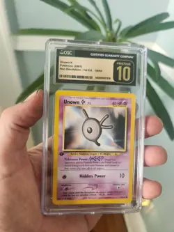 (POP 13) CGC 10 PRISTNE Unown K 58/64 1st Edition Neo Revelation WOTC Pokemon - Image 1
