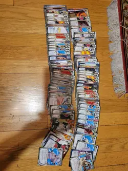 Naruto Shippuden CCG lot, Super Rares, Rares and card tin - Image 1