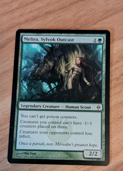 MTG Melira, Sylvok Outcast New Phyrexia NM - Image 1