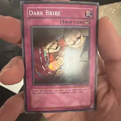 Yugioh Dark Bribe Super Rare GX04 EN002 MP - Image 1