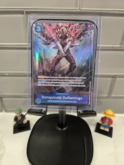 One Piece CCG Donquixote Doflamingo WWE SUCK IT Alternate Art Foil OP01-073 Eng - Image 1