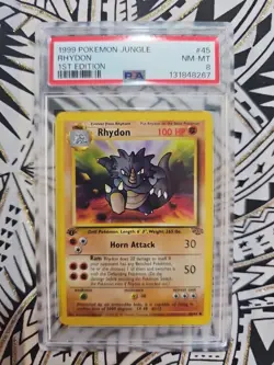 RHINOFEROS UNCO 1999 VINTAGE POKEMON 45 JUNGLE 1ST EDITION PSA 8 NM-MINT (267) - Image 1
