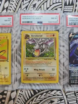 1999 VINTAGE POKEMON FOSSIL #1 AERODACTYL-HOLO PSA 8 NM-MINT (485) - Image 1