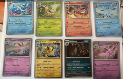 Pokemon Prismatic Evolutions Cosmo Promo Cards 8 Mini Tin Costco Pack - Image 1