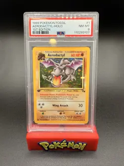 1999 POKEMON FOSSIL 1ST EDITION #1/62 AERODACTYL HOLO RARE PSA 8 - Image 1