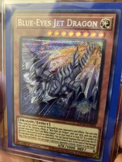 Blue-Eyes Jet Dragon Battle of Chaos 1st Edition Secret Rare Card BACH-EN004 - Image 1