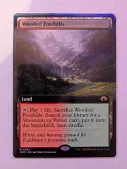 MTG Modern Horizons 3 Rare Card #467 Wooded Foothills (Extended Art) - Image 1
