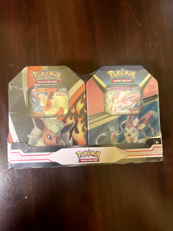 Pokemon Trading Card Game: Flareon Syleveon Tin Bundle 820650855641 - Image 1