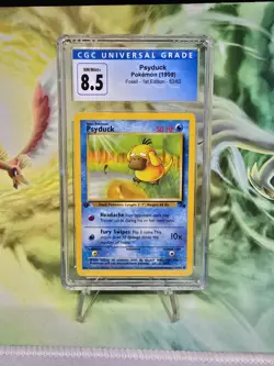 1999 Psyduck Fossil 1st Edition Pokemon TCG Card 53/62 HP - CGC 8.5 - NM/MINT+ - Image 1