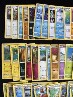 100+ Pokemon Card Lot W/ Mimikyu Tin, Coins, Dice - Image 4