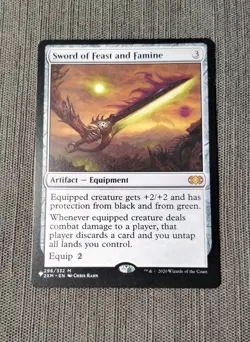 NM Sword of Feast and Famine 296/332 "The List" Reprint Double Masters - Image 1
