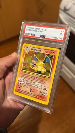 Pokemon TCG Charizard Holo Rare Card Base Set, PSA 7 - Image 1