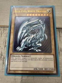 Blue-Eyes White Dragon - Ultimate Rare OP28-EN001 - Near Mint - Image 1