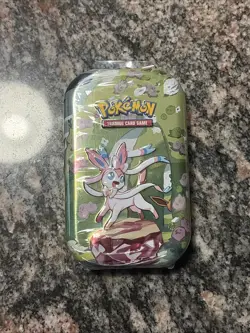 Pokemon TCG Scarlet & Violet Prismatic Evolutions Mini Tin SEALED NEW Sylveon - Image 1