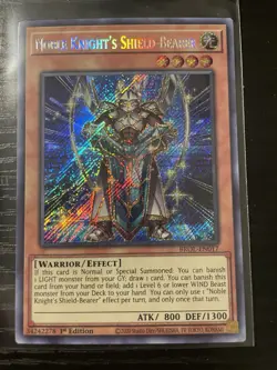 Noble Knight's Shield-Bearer - Yugioh Brothers of Legend Secret Rare BROL-EN017 - Image 1