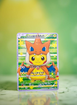 Poncho-Wearing Pikachu Charizard Gold Metal Pokemon Card Collectible Display - Image 1
