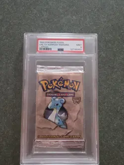 1999 Pokemon Unlimited Narrow Margins Fossil Lapras PSA 9 Booster Pack MINT - Image 1
