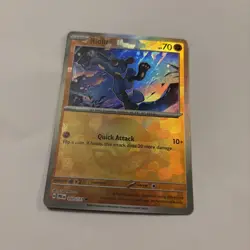 Pokemon Prismatic Evolutions TCG Riolu Pokeball Reverse Holo Card 050/131 - Image 1