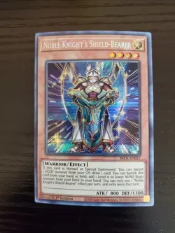 Noble Knight's Shield-Bearer - Yugioh Brothers of Legend Secret Rare BROL-EN017 - Image 1