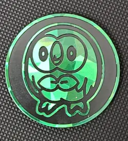 Pokemon TCG Rowlett Green Cracked Ice Holo Coin - Image 1