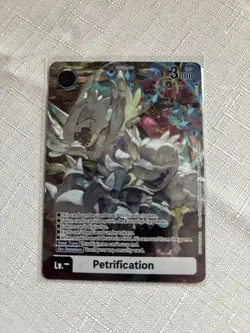 Digimon - BT24 Token Petrification - Box Topper Card In Hand - Image 1