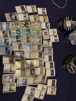 Three tins of Trainer cards, holos included. Pokemon chips too! Mostly NM - Image 1