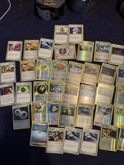 Three tins of Trainer cards, holos included. Pokemon chips too! Mostly NM - Image 2