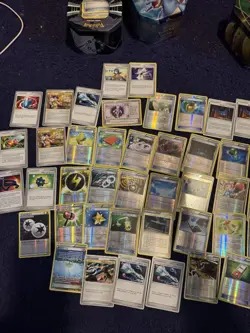 Three tins of Trainer cards, holos included. Pokemon chips too! Mostly NM - Image 3