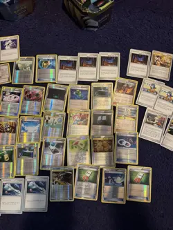 Three tins of Trainer cards, holos included. Pokemon chips too! Mostly NM - Image 4