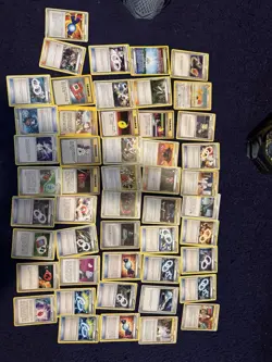 Three tins of Trainer cards, holos included. Pokemon chips too! Mostly NM - Image 5