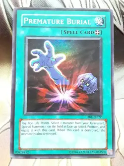 Yugioh Premature Burial Super Rare DB1-EN091 Lightly Played - Image 1