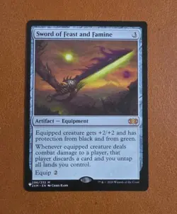NM Sword of Feast and Famine 296/332 "The List" Reprint Double Masters - Image 1