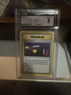 CGC 8 Item Finder 1999 Base Set 1st Edition Shadowless 74/102 Pokemon Card - Image 1