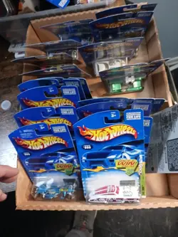 Lot Of 21 Hot Wheels DIECAST Cars In PACKAGES. Yugioh. He-man. More. Rare - Image 1