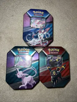 Pokemon TCG V HEROES Tins Set of 3 Espeon, Sylveon, And Umbreon - Image 1