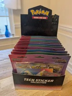 Pokemon TCG Prismatic Evolution Tech Sticker Collection 12ct Display Case - Image 1
