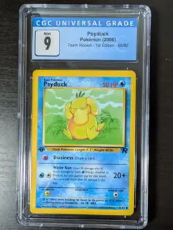 CGC 9 MINT Psyduck 2000 Team Rocket 1st Edition 65/82 Pokemon Card - Image 1