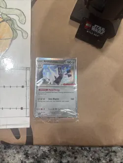 Pokemon TCG Archaludon Stamped Promo Card 107/142 GameStop - Image 1