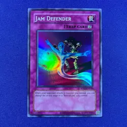 Jam Defender (Super Rare) (Retro Pack 2 Reprint) RP02-EN036 (NM) - Image 1