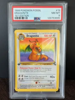 1999 POKEMON TCG FOSSIL #19 DRAGONITE 1ST EDITION - PSA 8 NM-MT - Image 1