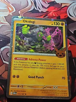 Okidogi (Cosmos Holo) W/ 2 Swirls 111/167 Trick or Trade 2024 Stamped Card NM - Image 1