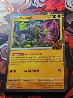 Okidogi (Cosmos Holo) W/ 2 Swirls 111/167 Trick or Trade 2024 Stamped Card NM - Image 2
