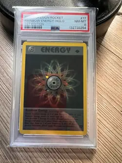 1st Edition Rainbow Energy 17/82 Holo Team Rocket PSA 8 NM-MT - 2000 WOTC - Image 1