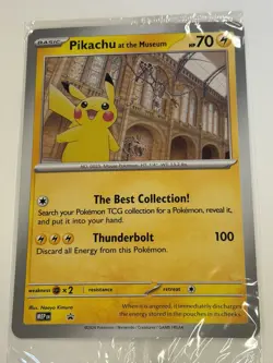 Pokemon x Natural History Museum Pikachu Jumbo Promo Card in hand - Image 1