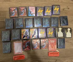 Pokemon TCG ETB Card Sleeves - Lot of 26 Sealed + Two Stands - Image 1