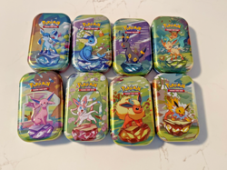Pokemon Prismatic Evolutions Mini Tins (8) - Tins only + Coin + Card (no packs) - Image 1