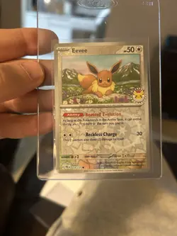 Eevee - (Pokemon Day 2025) (Reverse Cosmos Holo) 074/131 Swirls - Image 1